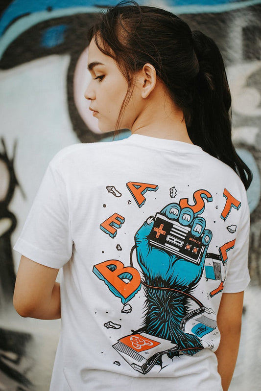 Confident woman in a black graphic tee, street style that broadcasts her message