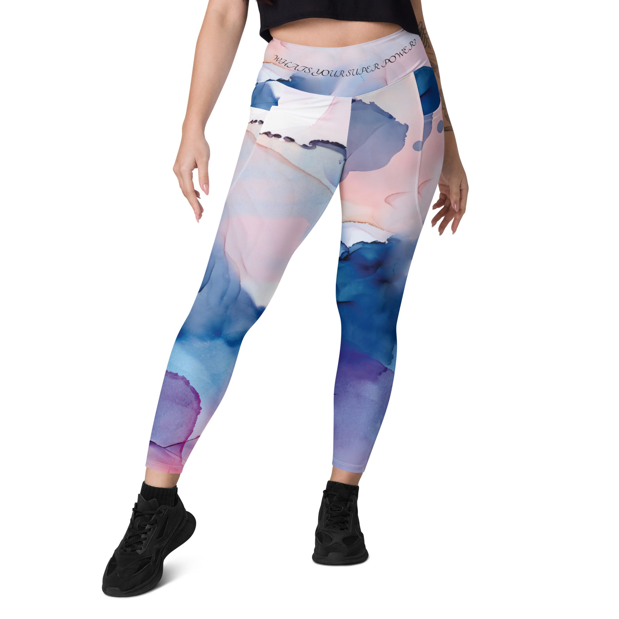 High-waisted leggings with side pockets, made from recycled polyester and elastane, featuring a flattering cut and UPF 50+ protection.