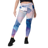 High-waisted leggings with side pockets, made from recycled polyester and elastane, featuring a flattering cut and UPF 50+ protection.