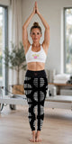 Super Soft Yoga Leggings with geometric print worn with Girl Power sports bra in a Pilates studio